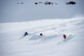 Three skiers headed down a powdery mountain in Iceland.